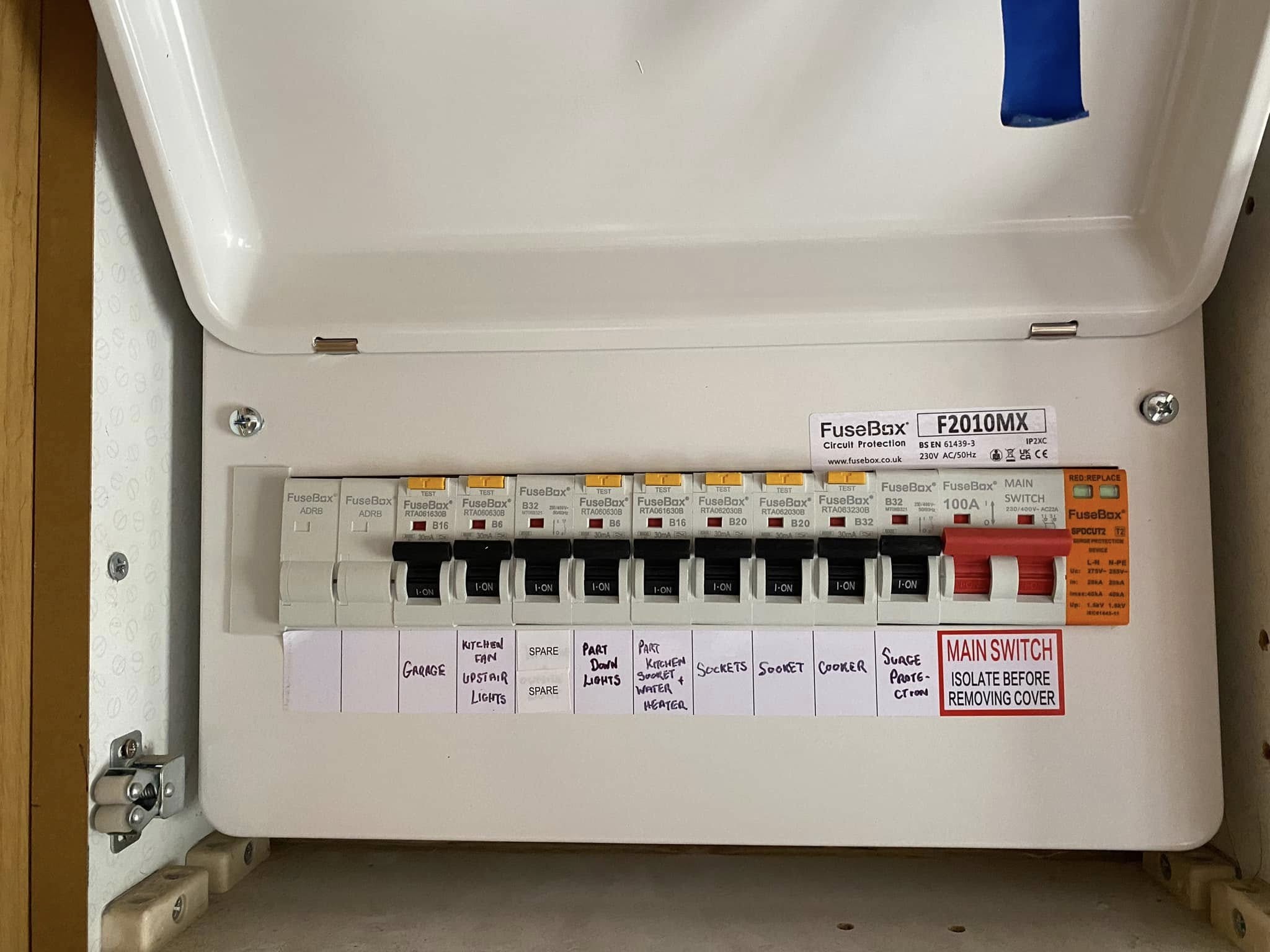 Open FuseBox consumer unit with each circuit labelled by hand